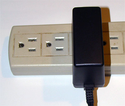 Thin style power brick doesn't block other power receptacles.