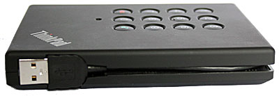 Lenovo Secure Drive's tethered USB cable in the compartment.