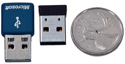 The mouse's wireless USB receiver (middle).