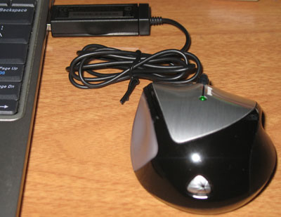 The LED on the top of the mouse glows green when charging.
