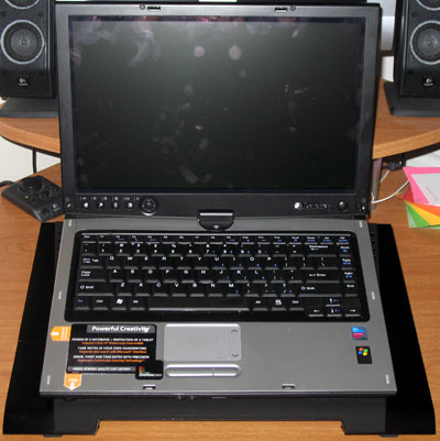 This 15-inch notebook fits handily on the Cryo LX's large surface.