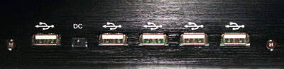 A close up for the 4 + 1 USB hub and DC connection.