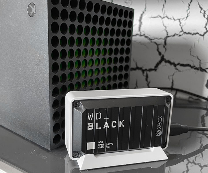 Western Digital WD_BLACK D30 sitting next to Xbox Series X